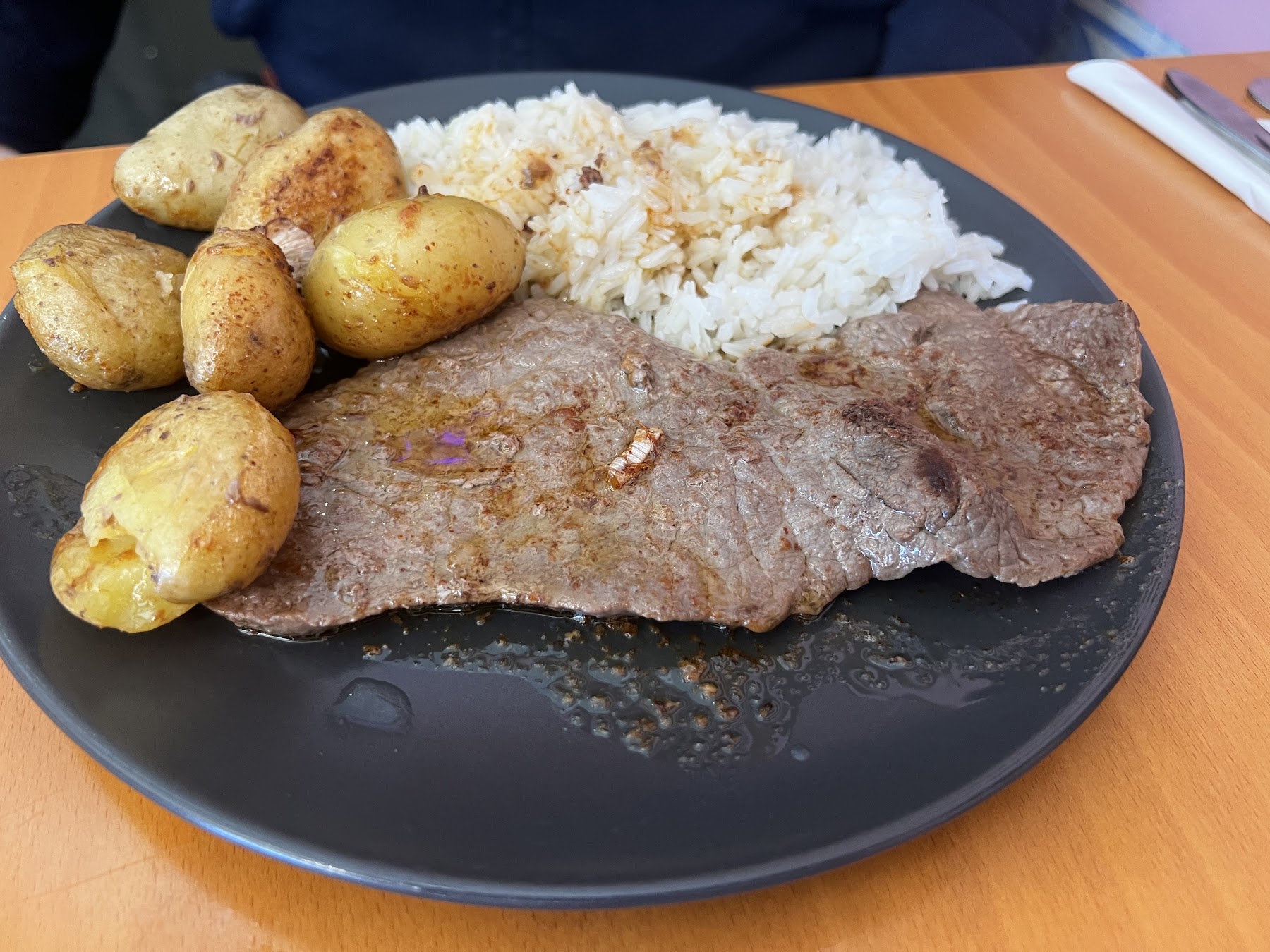 steak with potatoes and rice