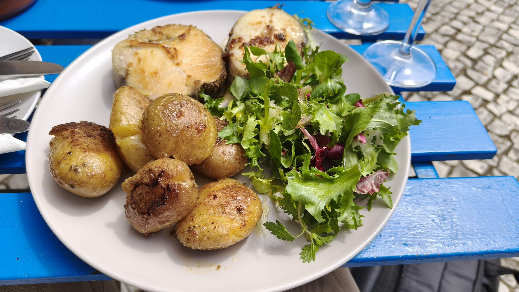 grilled fish with potatoes and salad